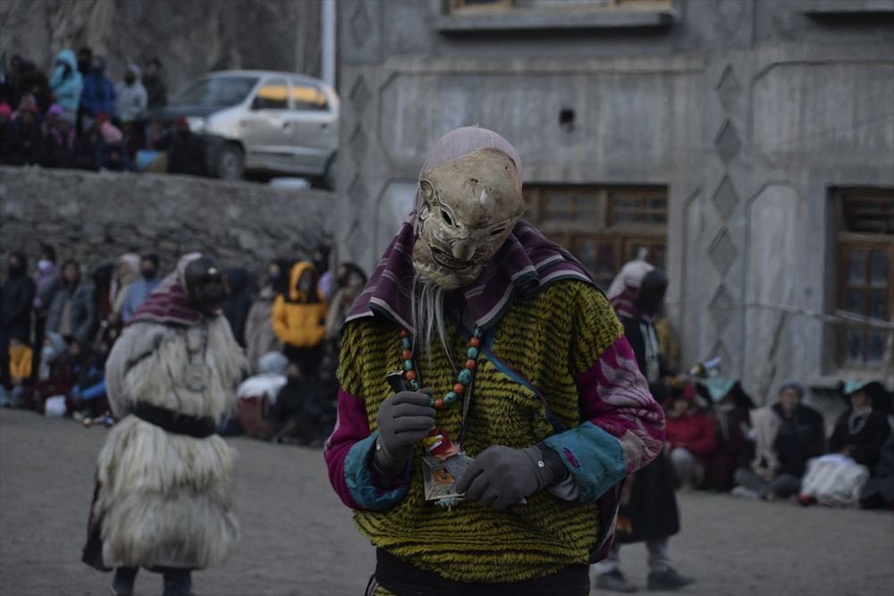 Villagers gathered for a masked cham dance in Ladakh